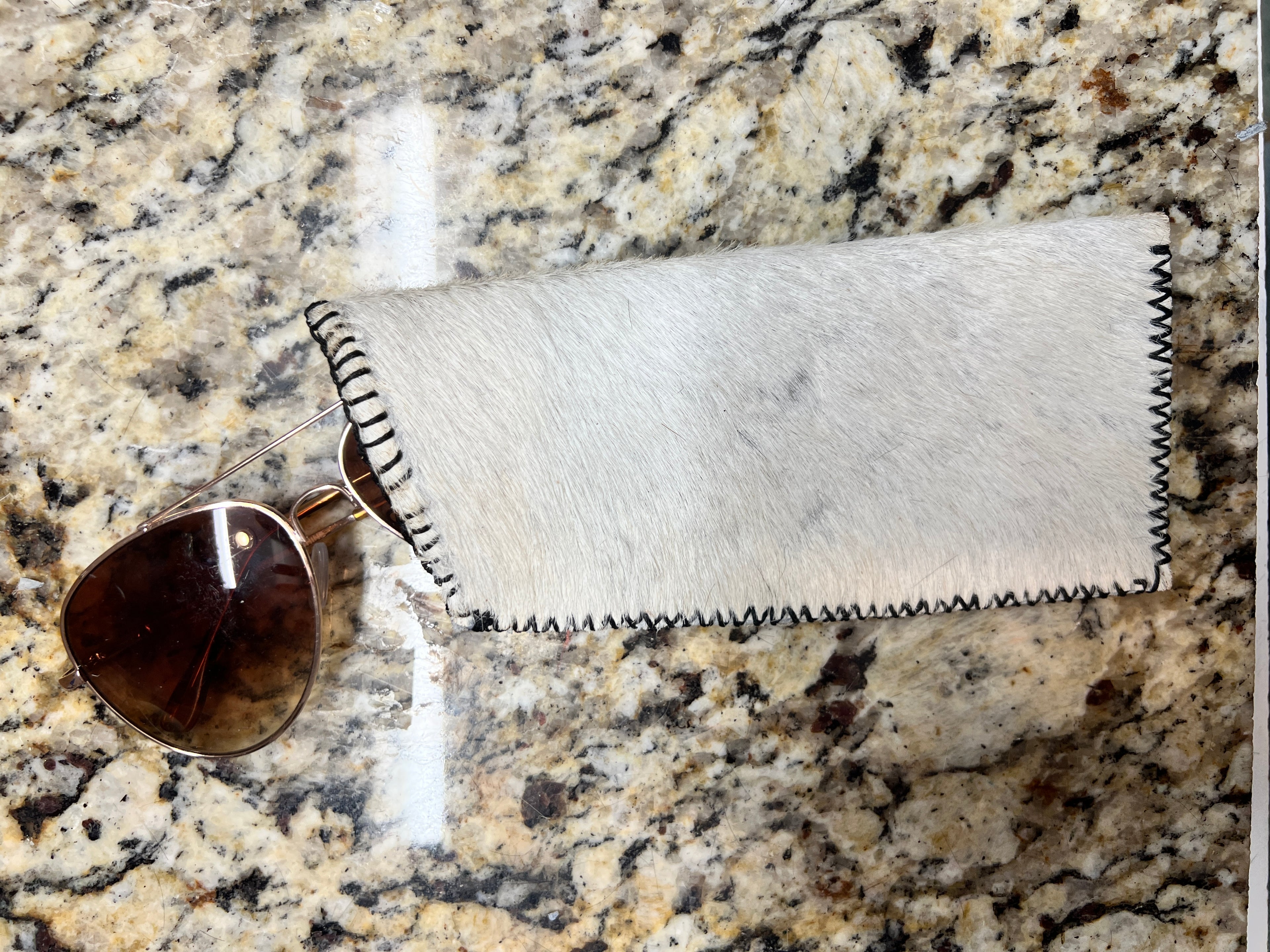 White cowhide sunglasses case