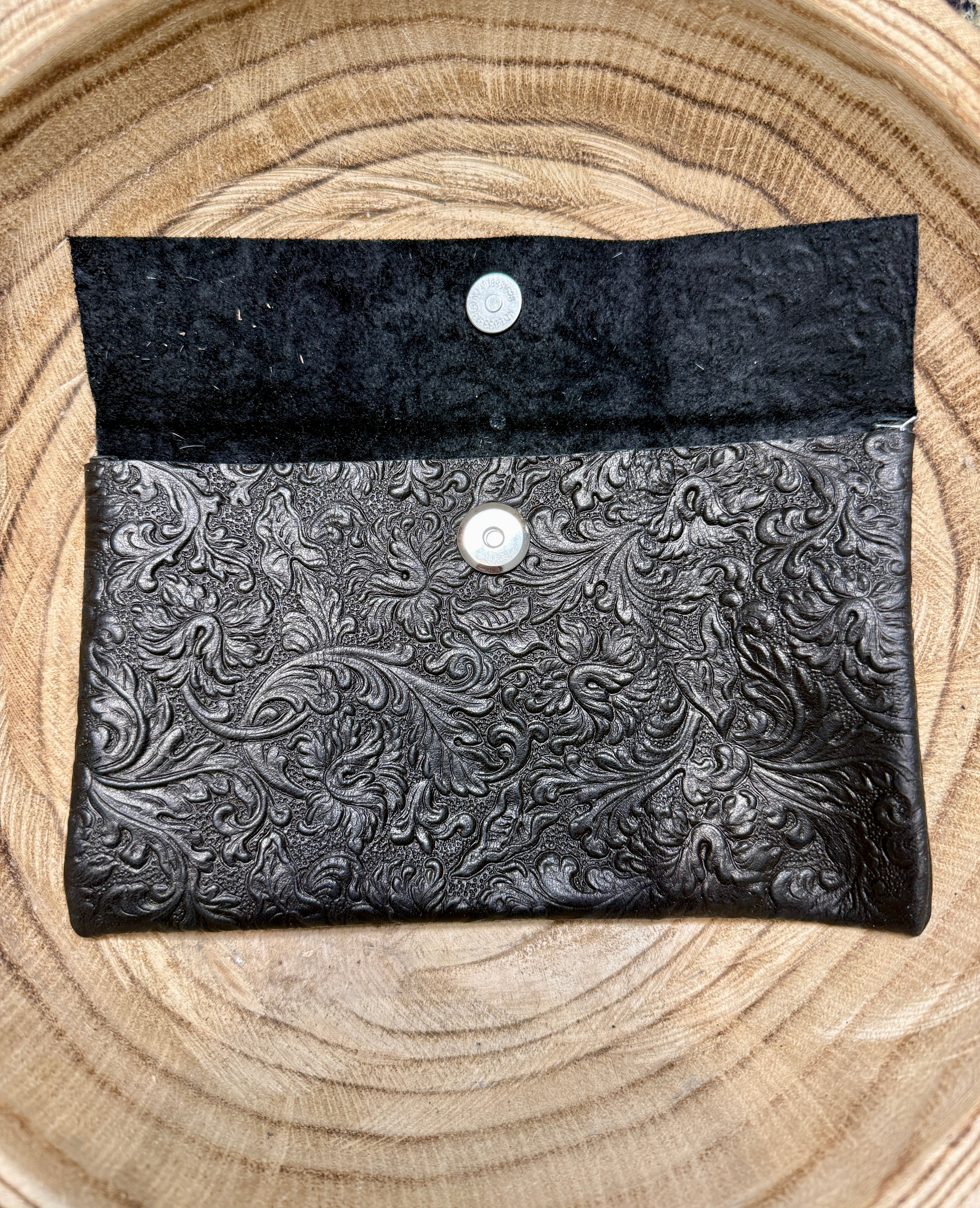 Black textured pouch bag